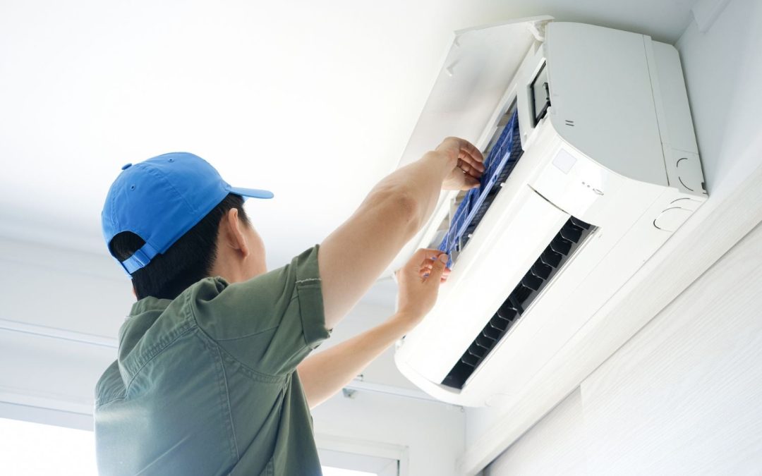 HVAC technician servicing a ductless mini split in San Lorenzo