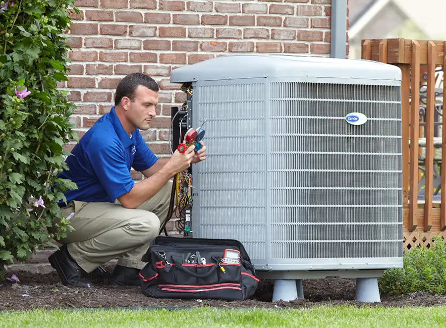 HVAC technician inspecting an outdoor AC unit in San Lorenzo